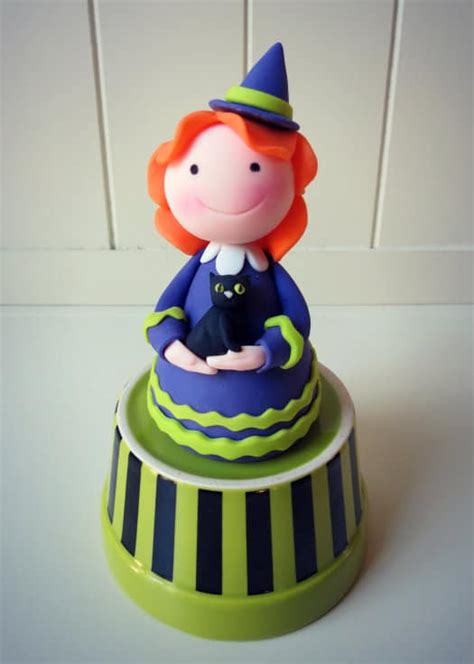 Awaiting delivery witch cake topper